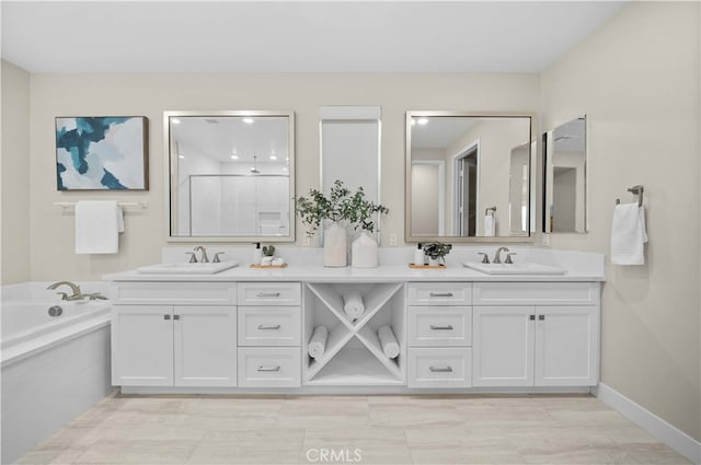 full bath featuring a shower, a bath, double vanity, and a sink