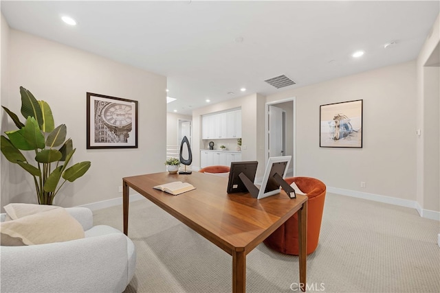 office space featuring visible vents, baseboards, recessed lighting, and light carpet