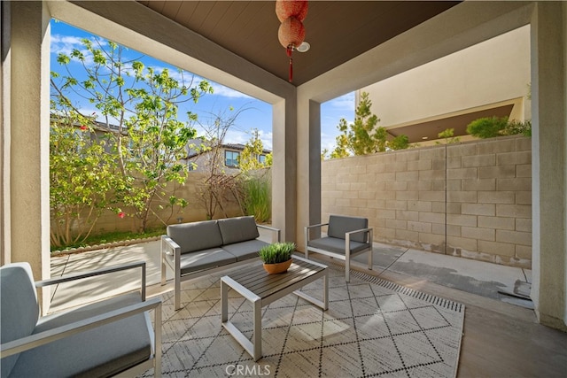 view of patio with outdoor lounge area and a fenced backyard