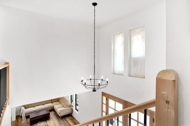 interior space with an inviting chandelier and wood finished floors