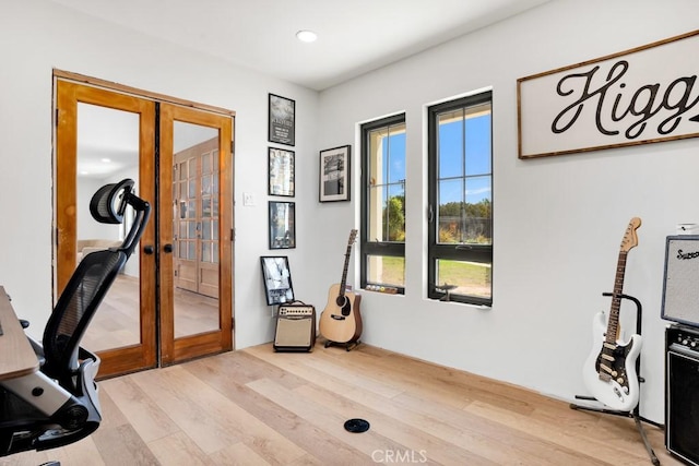 office featuring recessed lighting, light wood finished floors, and french doors