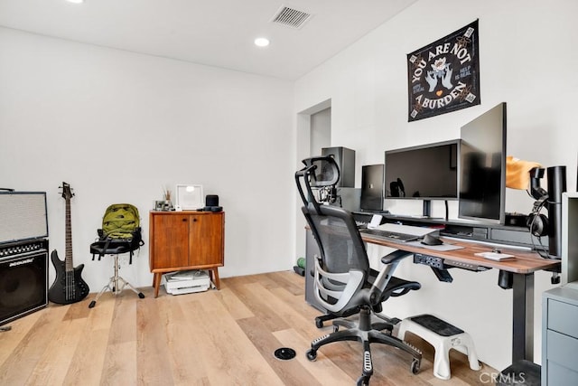 home office featuring visible vents, recessed lighting, and light wood-style floors