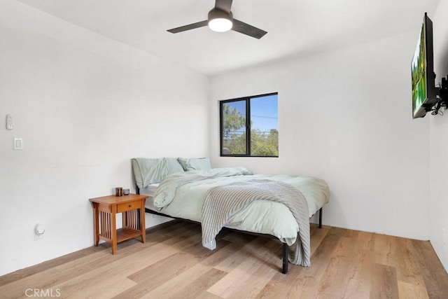 bedroom featuring wood finished floors and a ceiling fan