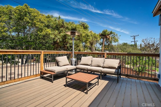 wooden deck featuring an outdoor hangout area