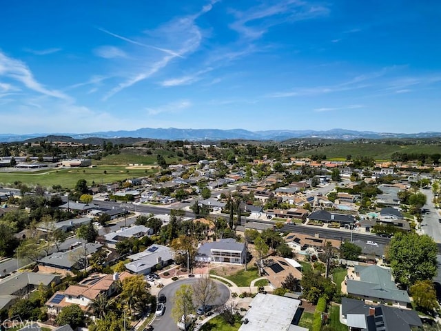 birds eye view of property featuring a mountain view and a residential view