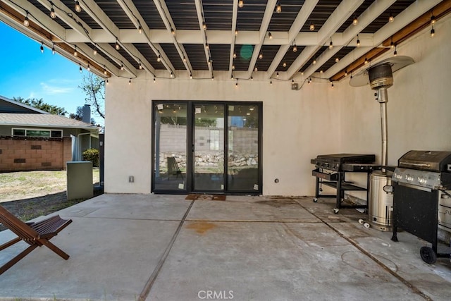 view of patio featuring fence and area for grilling