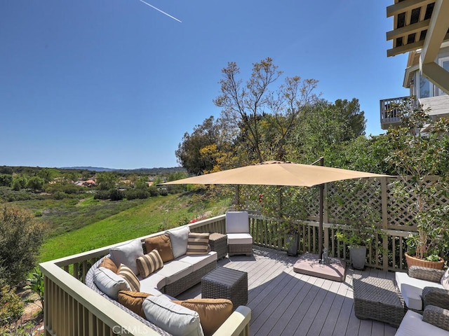 wooden terrace featuring an outdoor living space