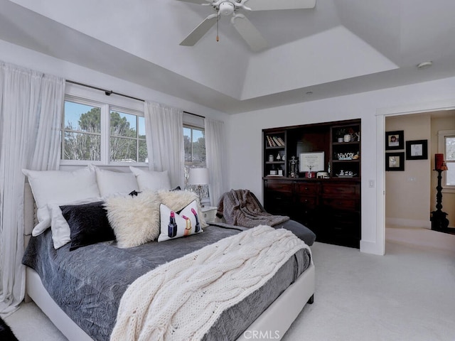 carpeted bedroom with baseboards and ceiling fan