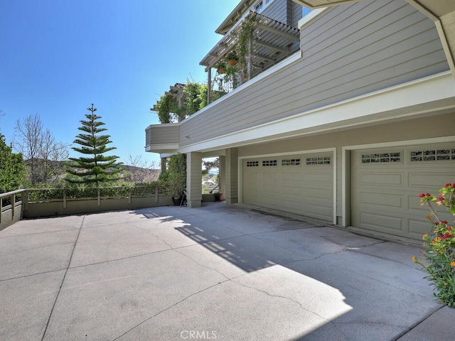 garage with concrete driveway