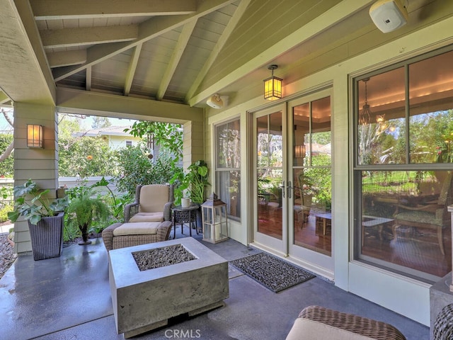 view of patio with an outdoor fire pit and french doors