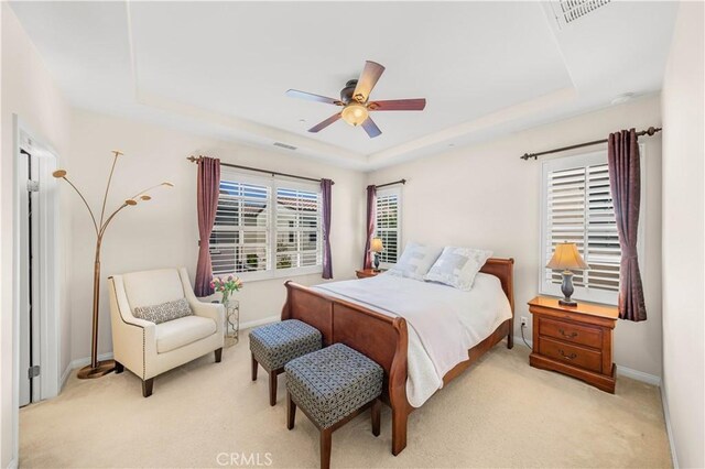 35 Jonquil, Irvine, CA 92618 - bedroom featuring a raised ceiling, light carpet, baseboards, and a ceiling fan