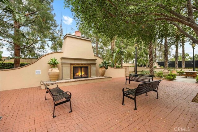 35 Jonquil, Irvine, CA 92618 - view of patio / terrace with an outdoor brick fireplace