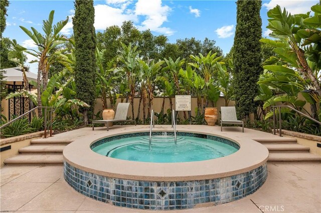 35 Jonquil, Irvine, CA 92618 - view of swimming pool with a hot tub, fence, and a patio area