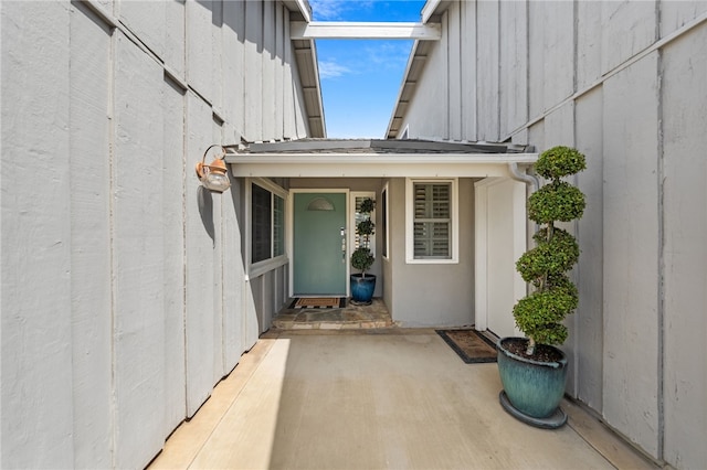 property entrance with a patio area