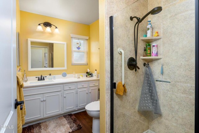 28210 Village 28, Camarillo, CA 93012 - bathroom with walk in shower, toilet, wood finished floors, and vanity
