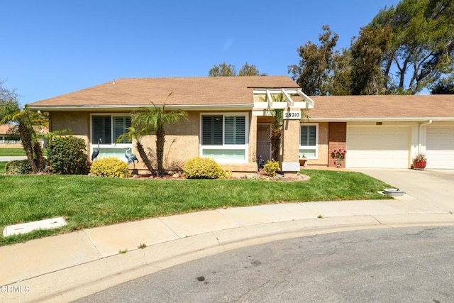 28210 Village 28, Camarillo, CA 93012 - ranch-style home featuring concrete driveway, a front lawn, stucco siding, and an attached garage