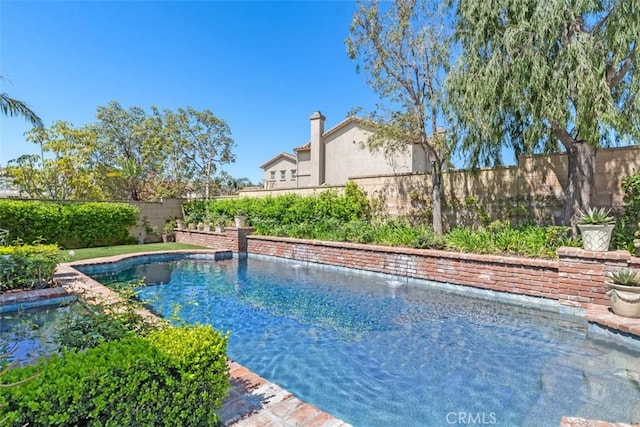 view of pool featuring a fenced backyard and a fenced in pool