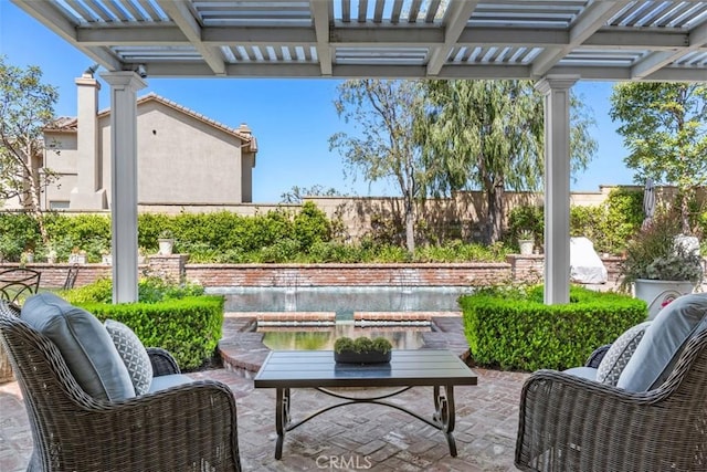 view of patio / terrace featuring a pergola and fence