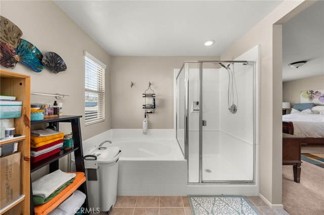 ensuite bathroom featuring a shower stall, a bath, ensuite bath, and tile patterned flooring