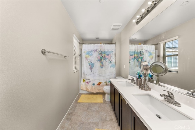full bath with toilet, baseboards, a sink, and visible vents