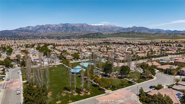 birds eye view of property with a mountain view and a residential view