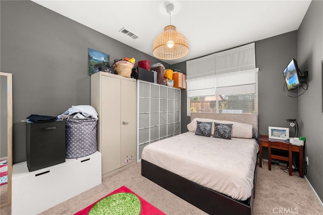 carpeted bedroom with visible vents