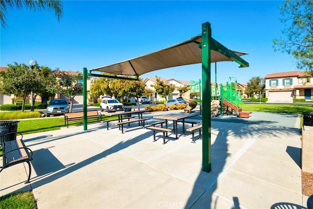 surrounding community featuring a lawn and playground community
