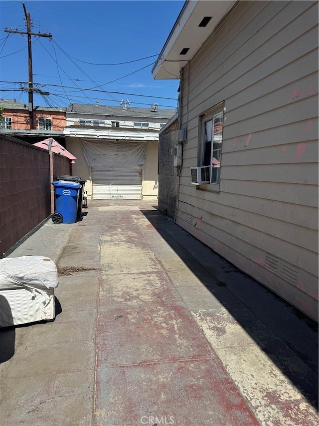 exterior space with a patio, cooling unit, and fence