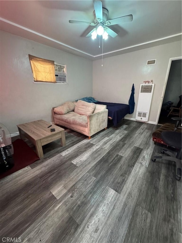 bedroom with visible vents, baseboards, a ceiling fan, and wood finished floors