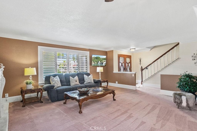 living area featuring baseboards, a textured ceiling, crown molding, stairs, and carpet flooring