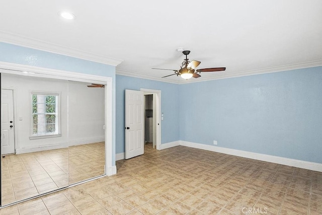 empty room with crown molding, baseboards, and a ceiling fan