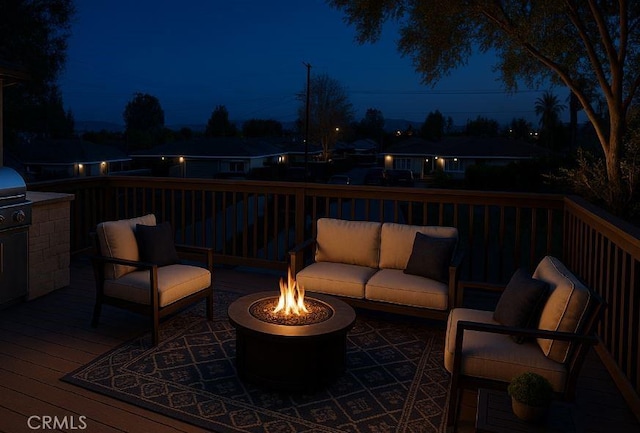 464 W E St, Colton, CA 92324 - deck at night featuring an outdoor living space with a fire pit