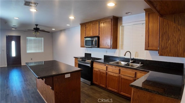 464 W E St, Colton, CA 92324 - kitchen featuring appliances with stainless steel finishes, a sink, ceiling fan, dark wood finished floors, and recessed lighting