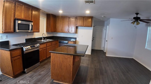 464 W E St, Colton, CA 92324 - kitchen with appliances with stainless steel finishes, a sink, dark wood finished floors, brown cabinetry, and recessed lighting