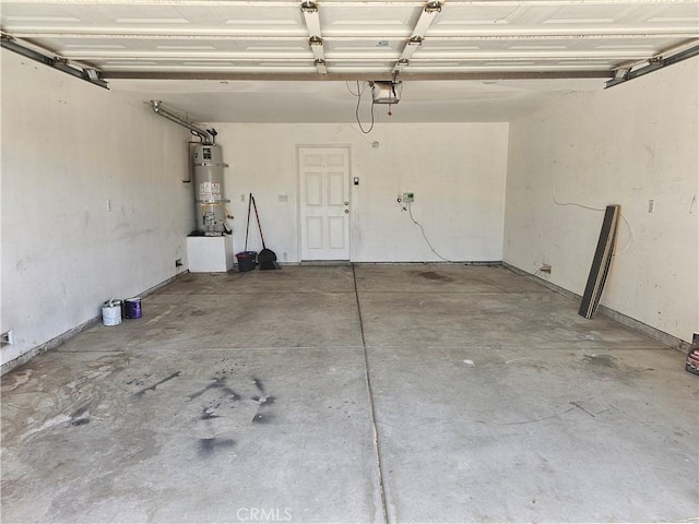 464 W E St, Colton, CA 92324 - garage with strapped water heater and a garage door opener
