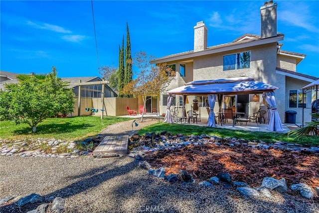 41768 Via El Greco, Temecula, CA 92592 - rear view of house with a chimney, stucco siding, and a patio area