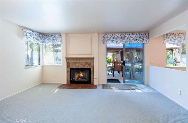 41768 Via El Greco, Temecula, CA 92592 - unfurnished living room with a tiled fireplace, healthy amount of natural light, carpet flooring, and baseboards