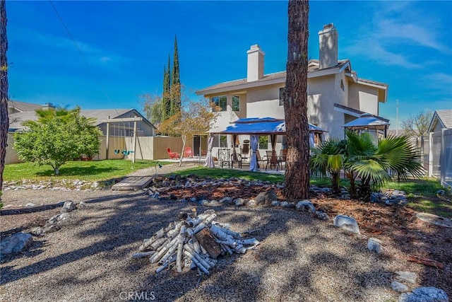 41768 Via El Greco, Temecula, CA 92592 - rear view of property with stucco siding, a patio area, and a chimney