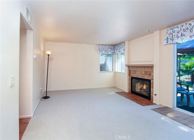 41768 Via El Greco, Temecula, CA 92592 - unfurnished living room with carpet flooring, a tiled fireplace, and baseboards