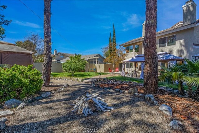 view of yard featuring a gazebo and fence