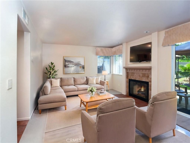 41768 Via El Greco, Temecula, CA 92592 - living area featuring wood finished floors, a tiled fireplace, and baseboards