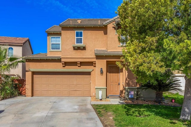 view of front of house with concrete driveway, stucco siding, a tiled roof, and an attached garage