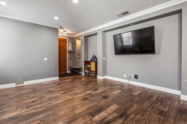 unfurnished living room with baseboards, recessed lighting, crown molding, visible vents, and wood finished floors