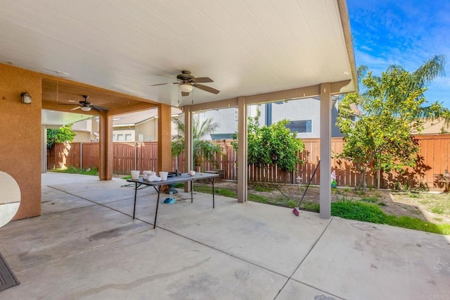 view of patio featuring a fenced backyard and a ceiling fan