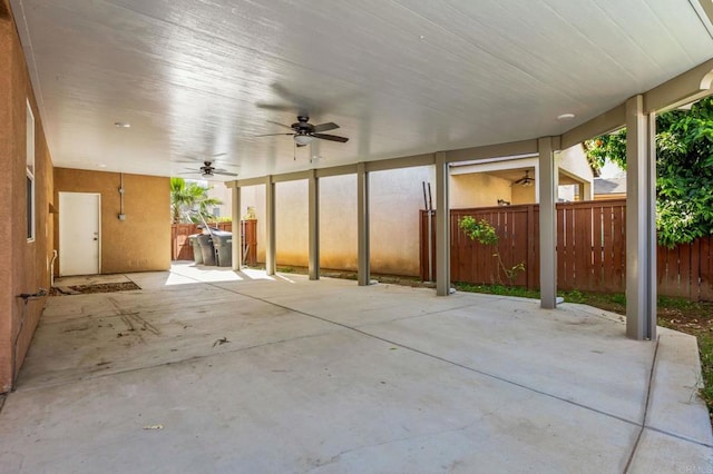 view of patio / terrace with a ceiling fan and fence