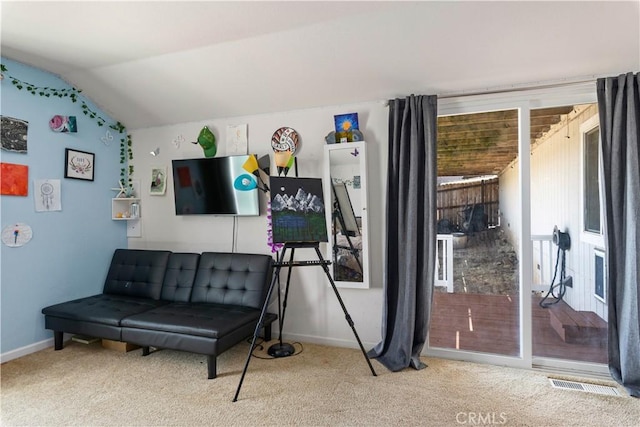 living area featuring carpet, visible vents, baseboards, and lofted ceiling