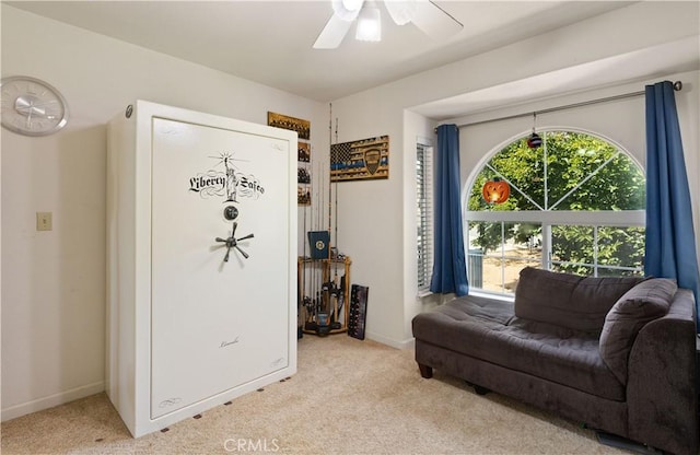 sitting room featuring carpet floors, ceiling fan, and baseboards