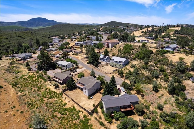 birds eye view of property with a mountain view and a residential view