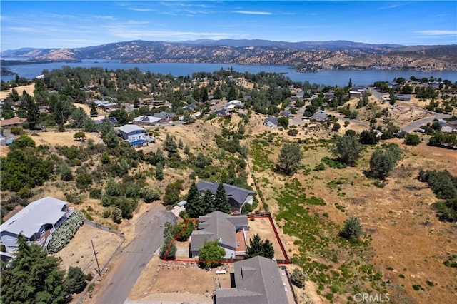 bird's eye view featuring a residential view and a water and mountain view