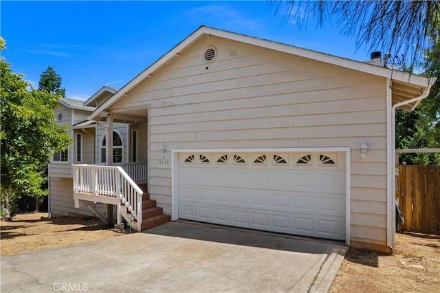 ranch-style house with fence, a chimney, concrete driveway, and a garage